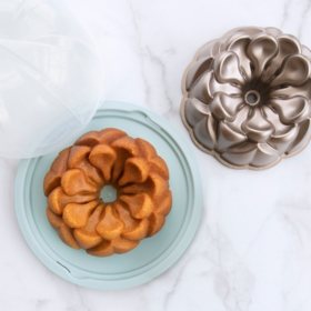 Nordic Ware Toffee Magnolia Bundt Pan with Blue and Clear Bundt Keeper