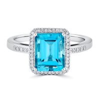 Blue Topaz and 0.14 CT. T.W. Diamond Ring in Sterling Silver