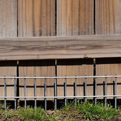 Under fence outlet dog barrier