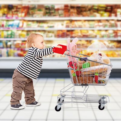 Baby pushing shopping store cart